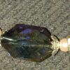 A close up of the top part of a necklace