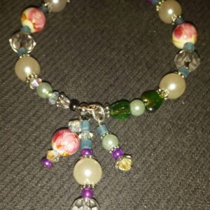 A bracelet with beads and charms on it