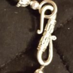 A close up of the clasp on a necklace