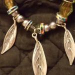 A close up of the feathers on a necklace