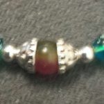 A close up of the beads on a necklace