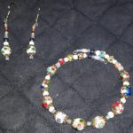 A necklace and earrings set with colorful beads.