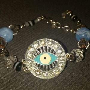 A bracelet with an eye on it and some beads