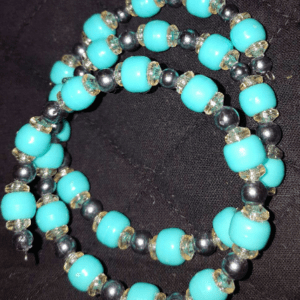 A close up of a necklace with beads