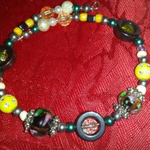 A necklace with beads and a wooden bead.