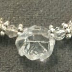 A close up of the bead on the necklace