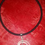 A necklace with a peace sign on it