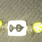 A close up of the beads on a bracelet