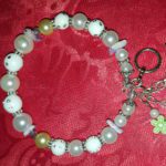 A bracelet with beads and charms on it