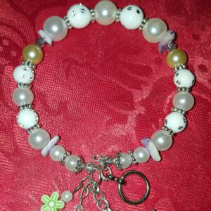 A bracelet with beads and charms on it
