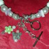 A close up of a necklace with charms